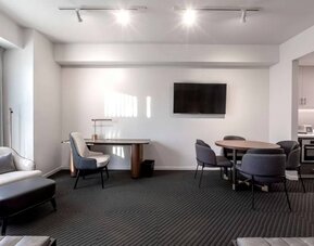 Workspace and dining table inside day use room at Hotel Chauncey.