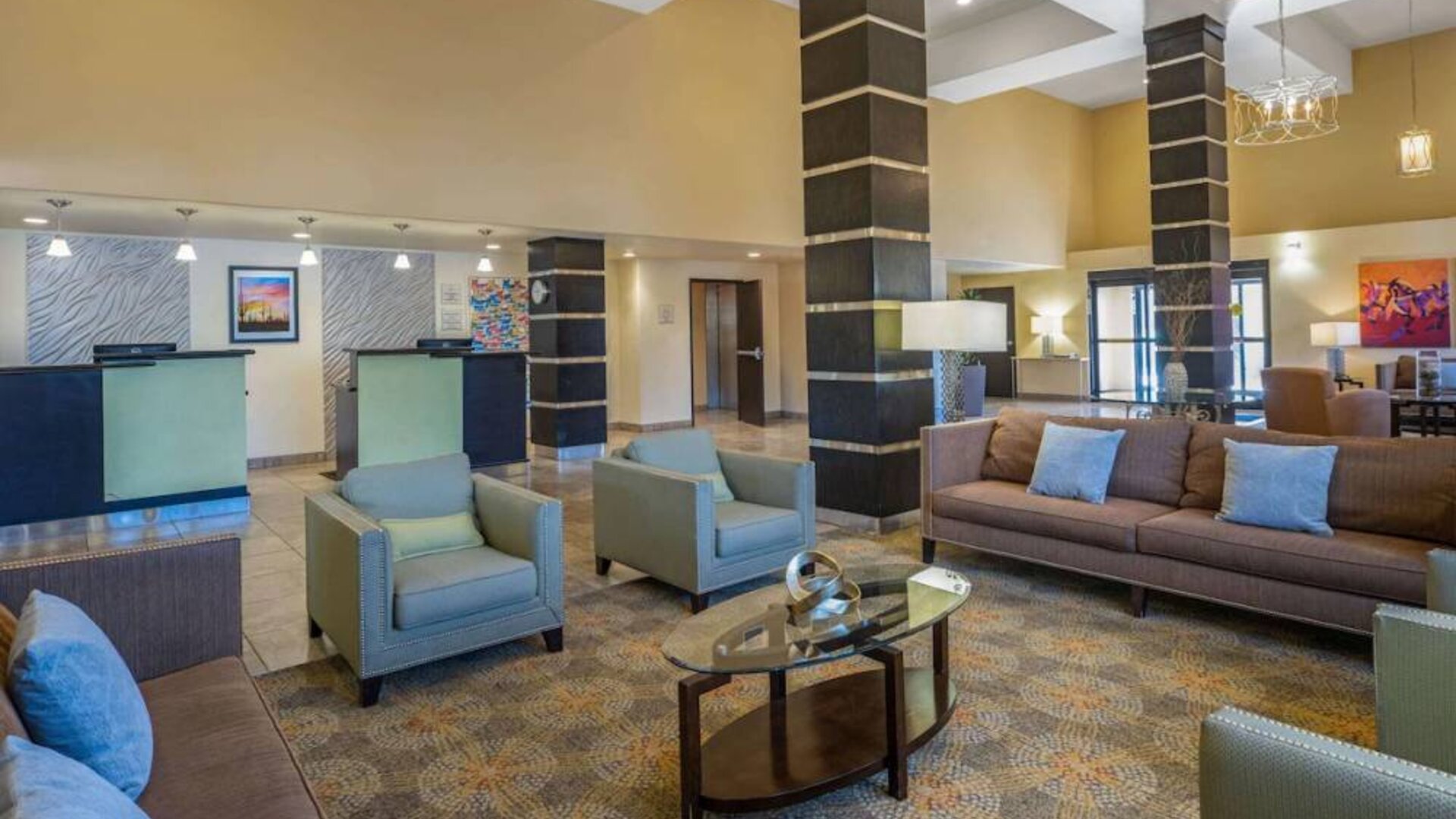 Lobby and coworking lounge at La Quinta Inn & Suites Tucson Reid Park.