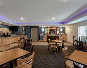 Dining area at AmericInn By Wyndham Sioux Falls North.