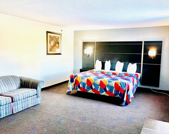 Spacious day use room with natural light at Coratel Inn & Suites By Jasper Northfield.