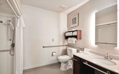 Private guest bathroom with shower at Homewood Suites By Hilton Dallas-Lewisville.