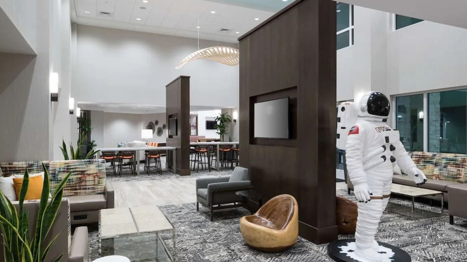 Lobby and coworking space at Hampton Inn & Suites Cape Canaveral Cruise Port.