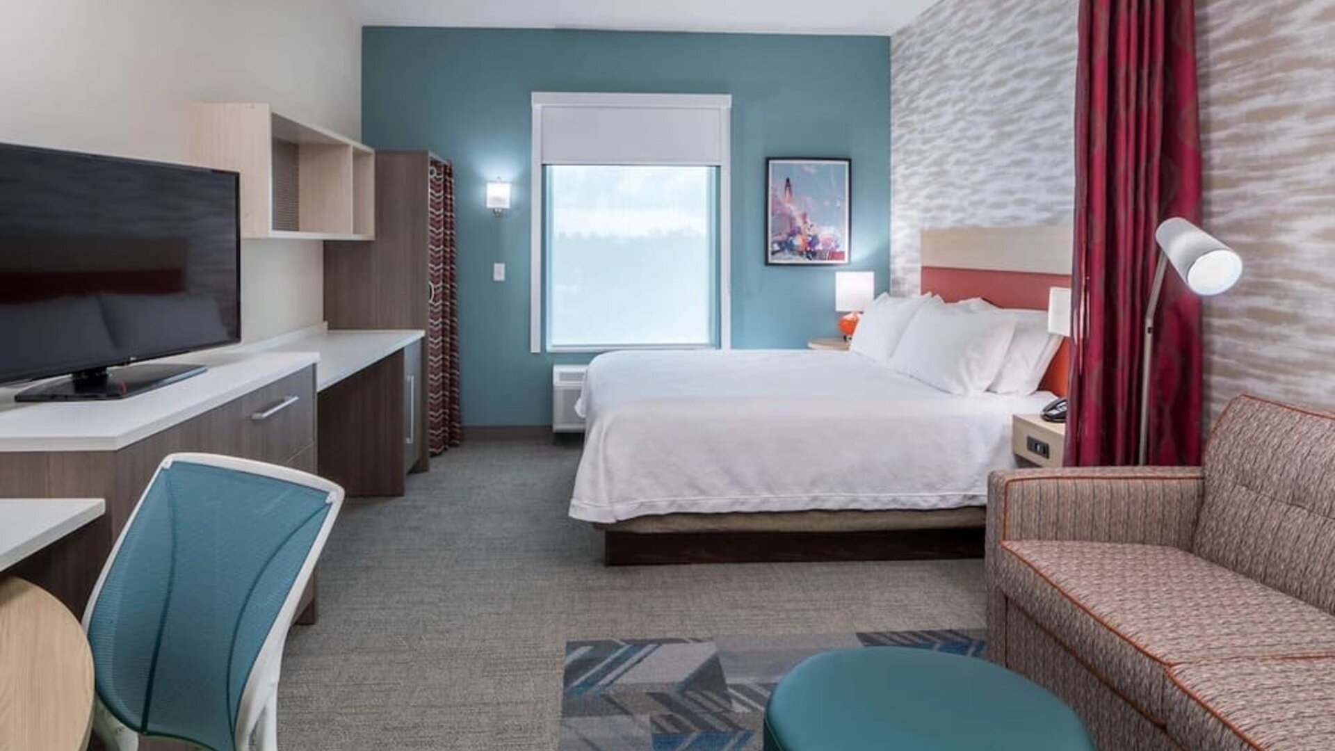 Delux king room with natural light at Home2 Suites By Hilton Cape Canaveral Cruise Port.
