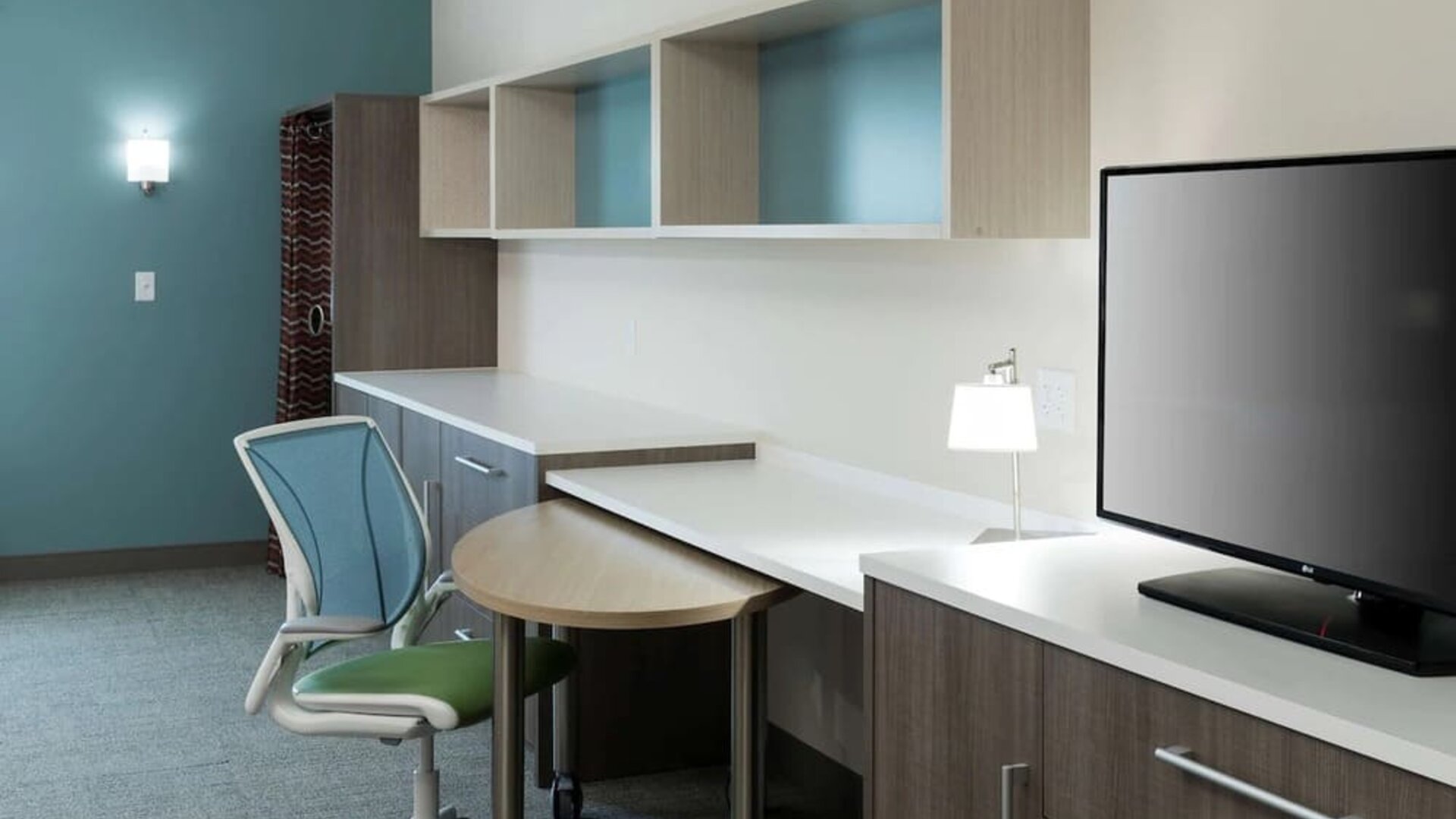 Day room with business desk at Home2 Suites By Hilton Cape Canaveral Cruise Port.