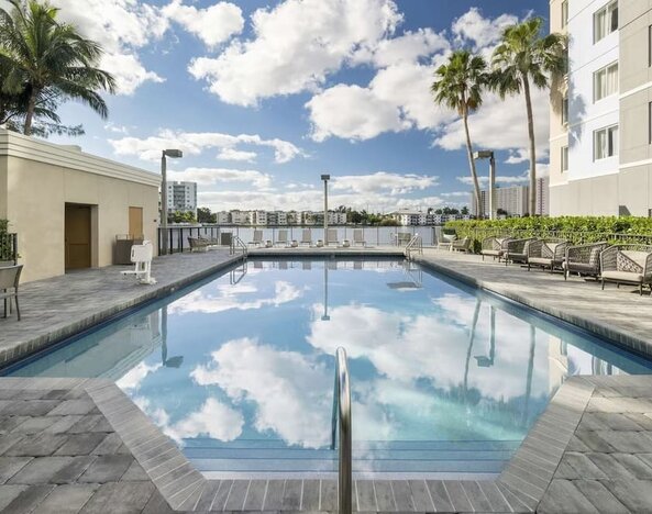 Refreshing outdoor pool at Homewood Suites By Hilton Miami Airport-Blue Lagoon.