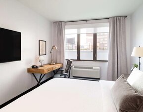 King bed with TV at Hilton Garden Inn New York/Tribeca.