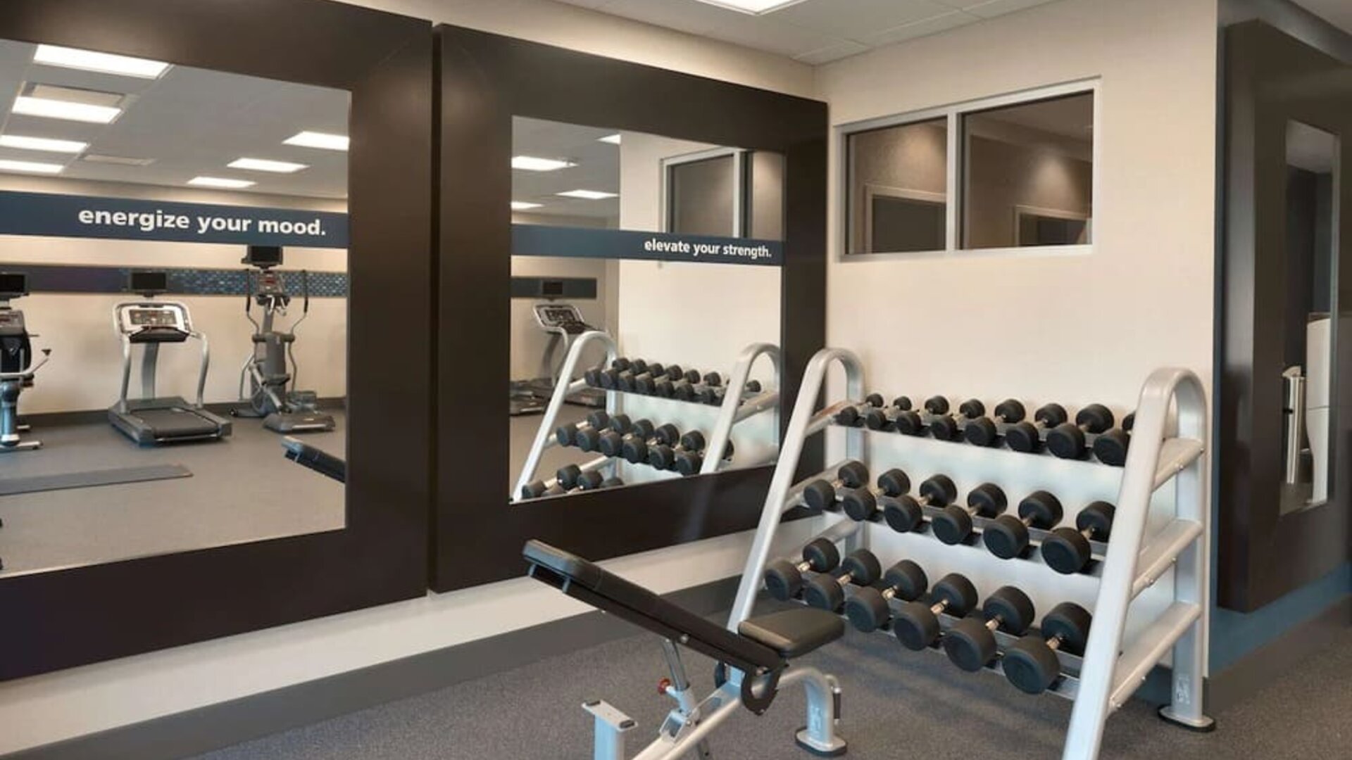 Equipped fitness center at Hampton Inn & Suites Rosemont Chicago O'Hare.
