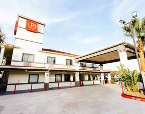 Hotel exterior at Palace Inn TX 249.