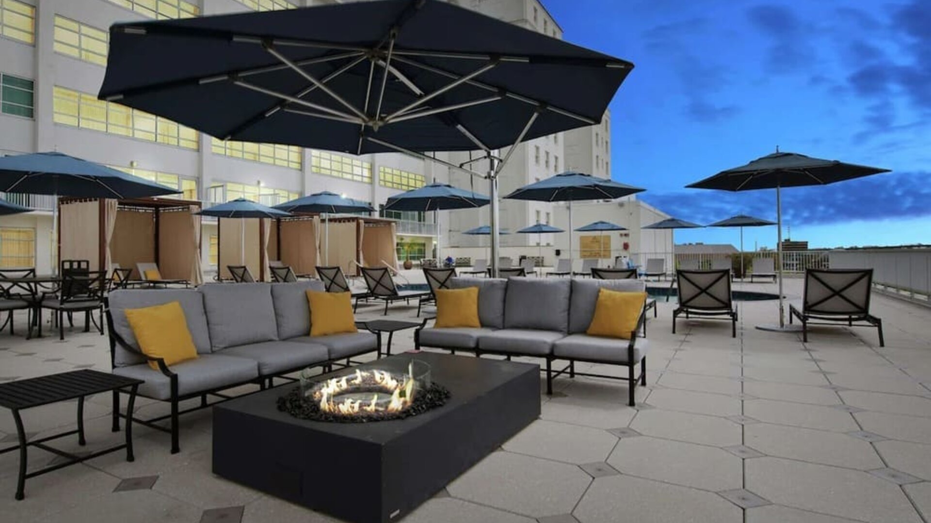 Relaxing outdoor terrace with fire pits at Hilton Baton Rouge Capitol Center.
