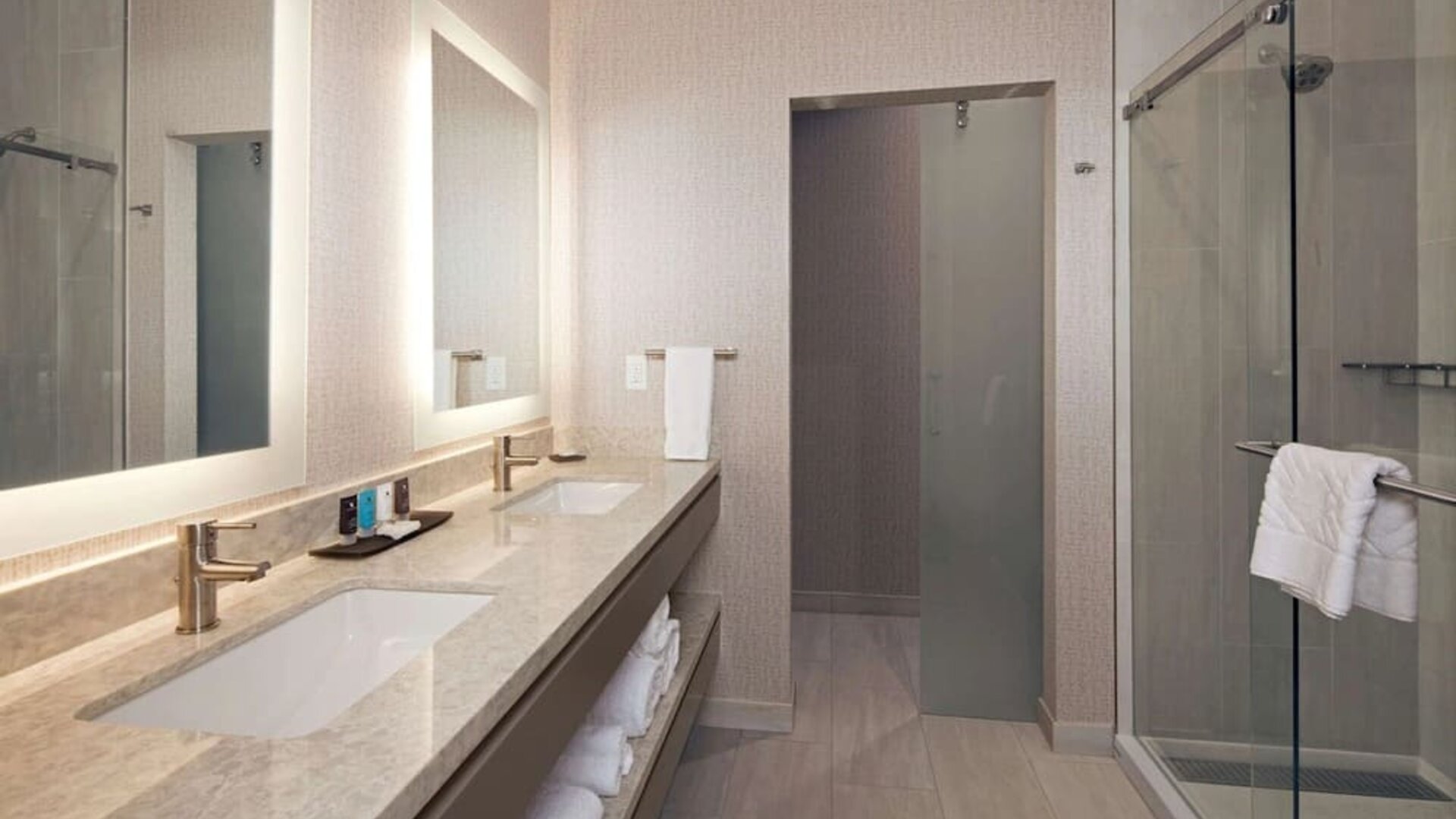 Guest bathroom with shower at H Hotel Los Angeles, Curio Collection By Hilton.