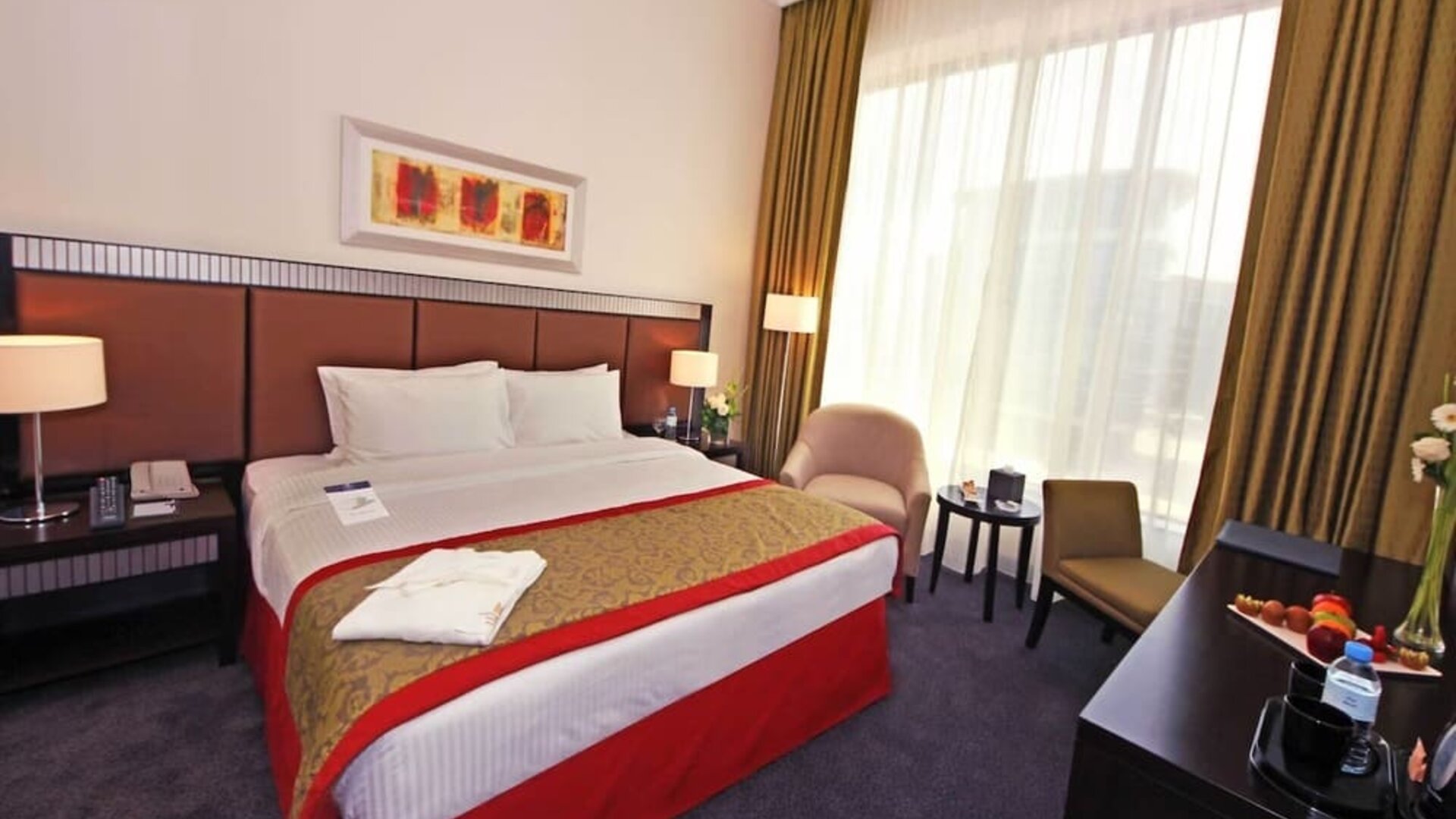 Delux king room with natural light at Millennium Central Doha.
