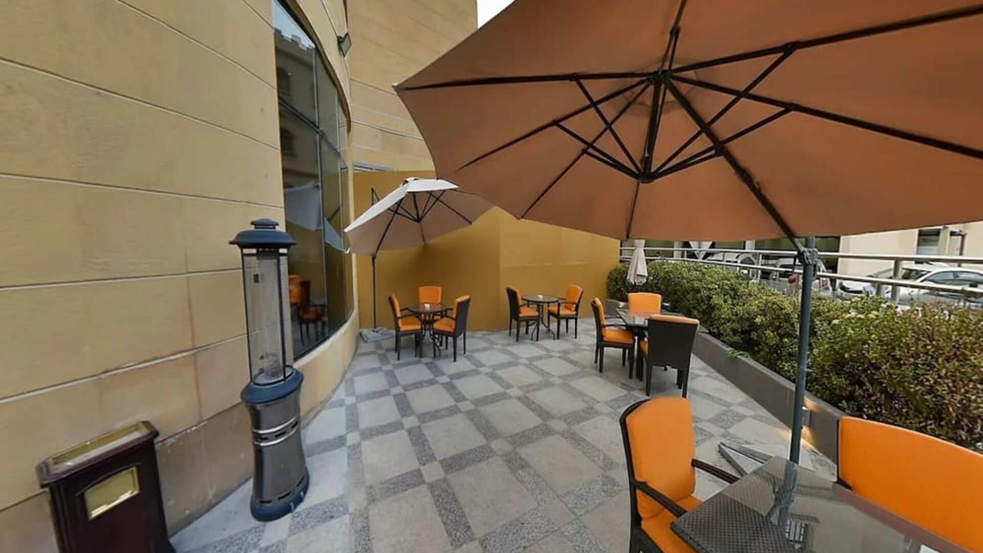 Outdoor terrace and coworking space at Millennium Central Doha.