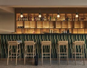 Dining and coworking space at OKKO Hotels Nice Aéroport.