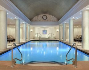 Stunning indoor pool with pool chairs at Hilton Short Hills.