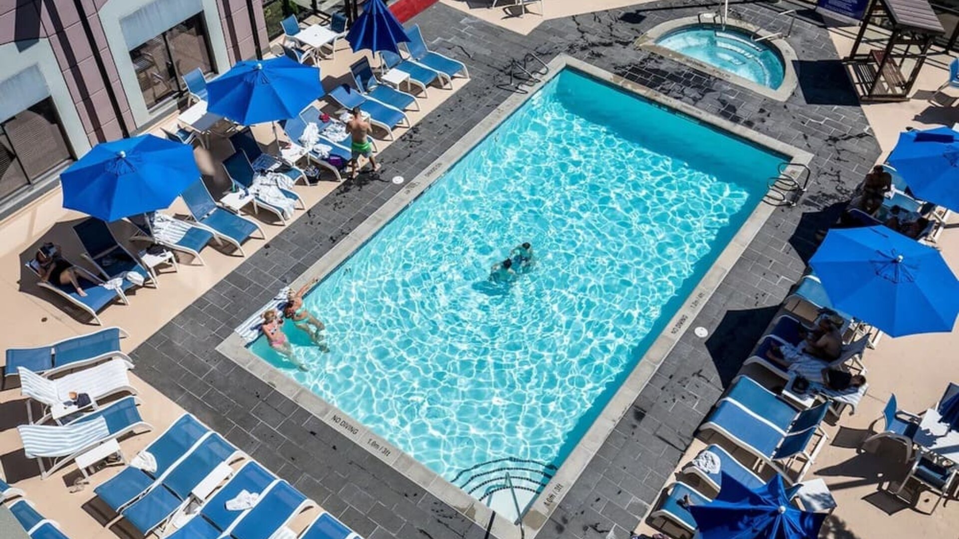 Relaxing pool area with pool chairs at Hilton Whistler Resort & Spa.