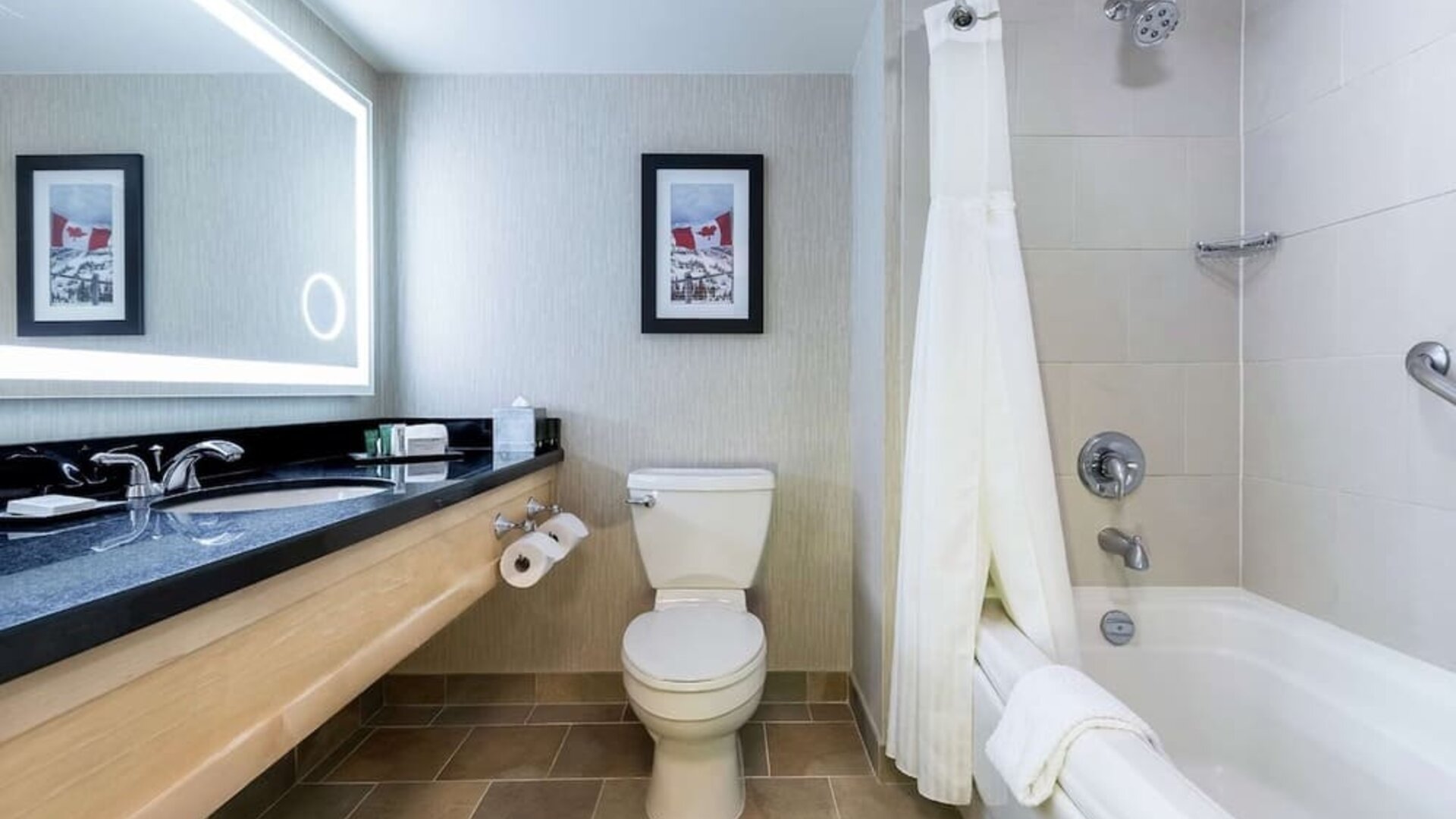 Guest bathroom with shower and bath at Hilton Whistler Resort & Spa.