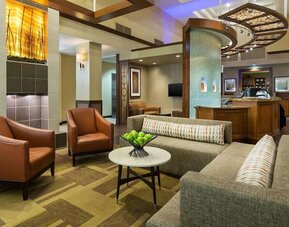 Lobby and coworking lounge at Hyatt Place Fort Lauderdale Cruise Port.