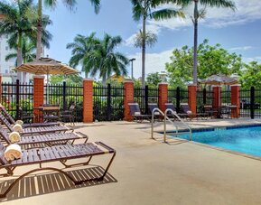 Sun loungers beside the pool at Hyatt PLACE Fort Lauderdale Airport - South & Cruise Port.
