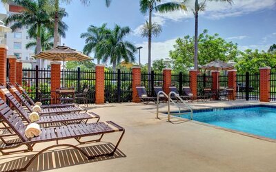 Sun loungers beside the pool at Hyatt PLACE Fort Lauderdale Airport - South & Cruise Port.