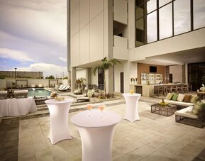 Seats available beside pool and bar at EB Hotel Miami.