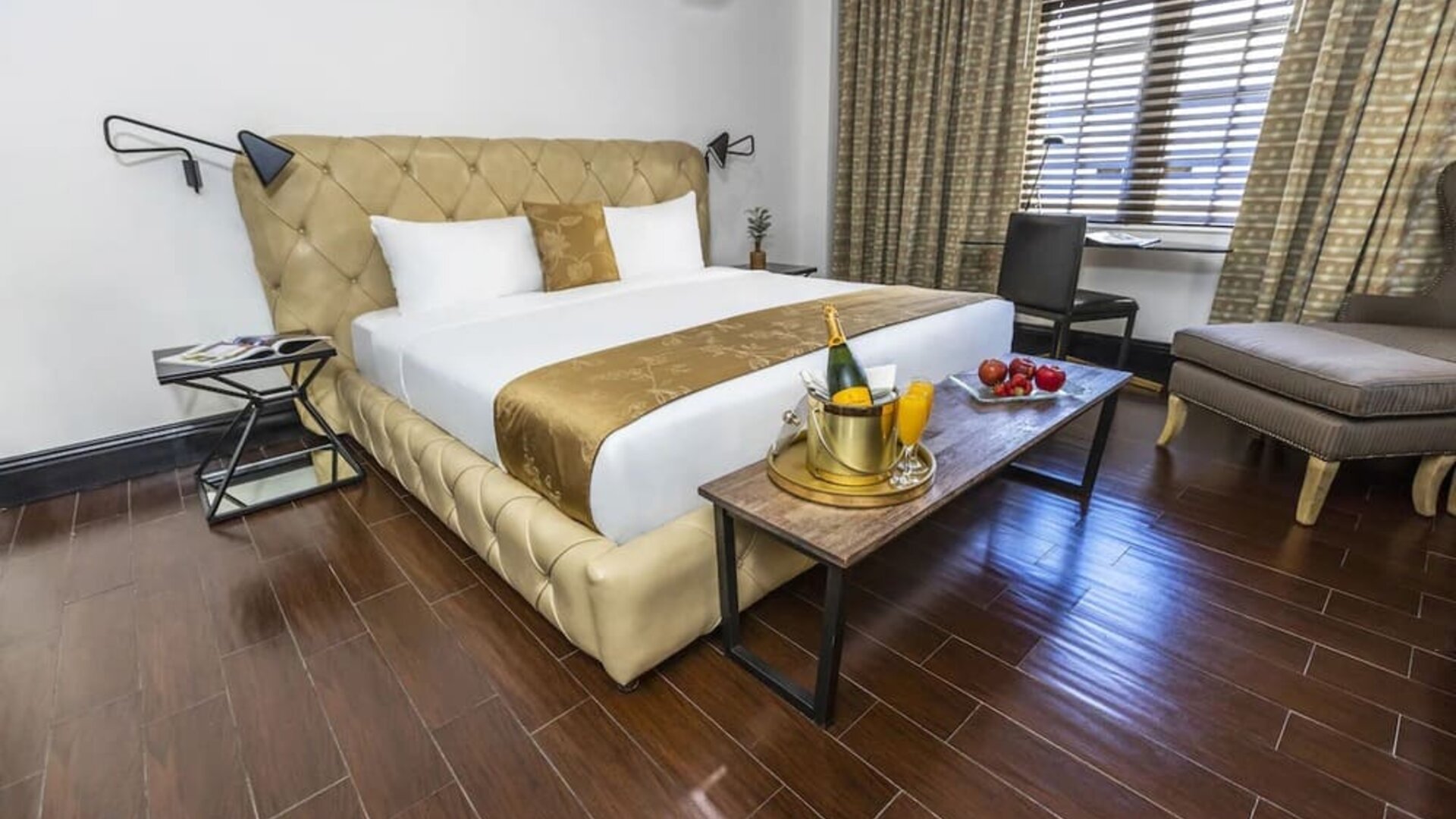 King bed with natural light at Hotel Croydon.