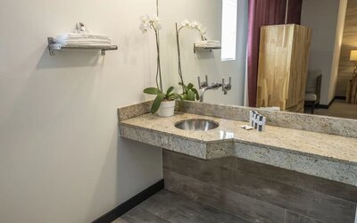 Guest bathroom with shower at Catalina Hotel & Beach Club.