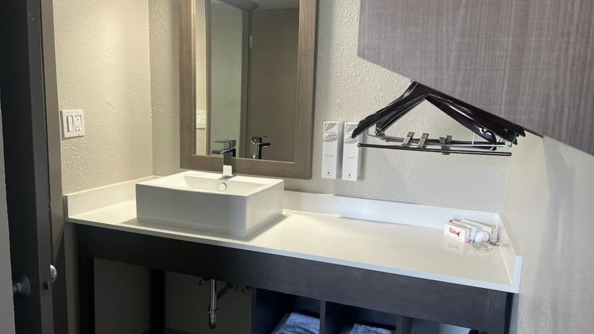 Private guest bathroom at Red Roof Plus Bourbonnais.