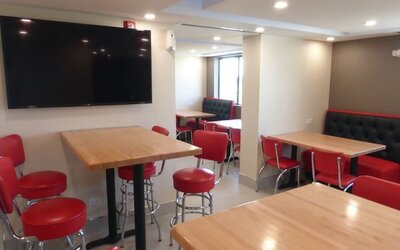 Dining and coworking space at Red Roof Plus Bourbonnais.