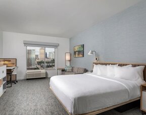 Day use room with work desk and sofa at TownePlace Suites Nashville Midtown.