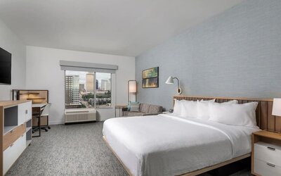 Day use room with work desk and sofa at TownePlace Suites Nashville Midtown.