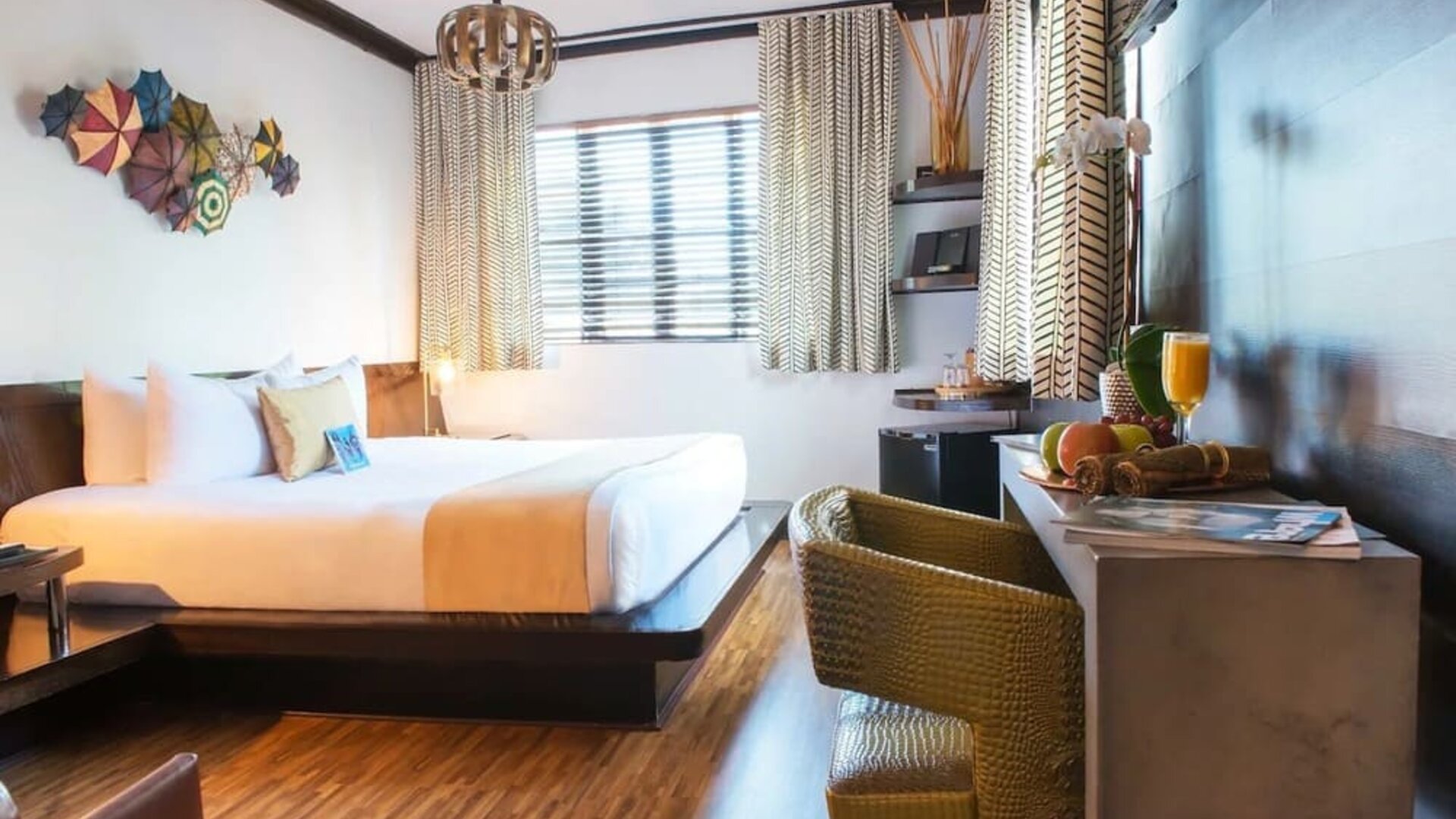 Cozy king bed with work space at Hotel Chelsea, A South Beach Group Hotel.