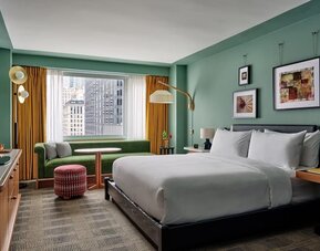 Deluxe king room with natural light and a desk at Romer Hell's Kitchen.