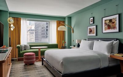 Deluxe king room with natural light and a desk at Romer Hell's Kitchen.