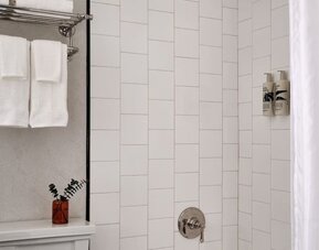 Private guest bathroom with shower at Romer Hell's Kitchen.