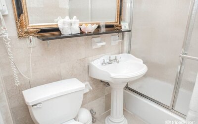 Guest bathroom with shower at Da Vinci Hotel.