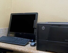 Business center with computer and printer at Travelodge LAX By Wyndham.