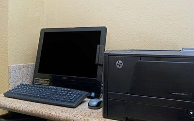 Business center with computer and printer at Travelodge LAX By Wyndham.
