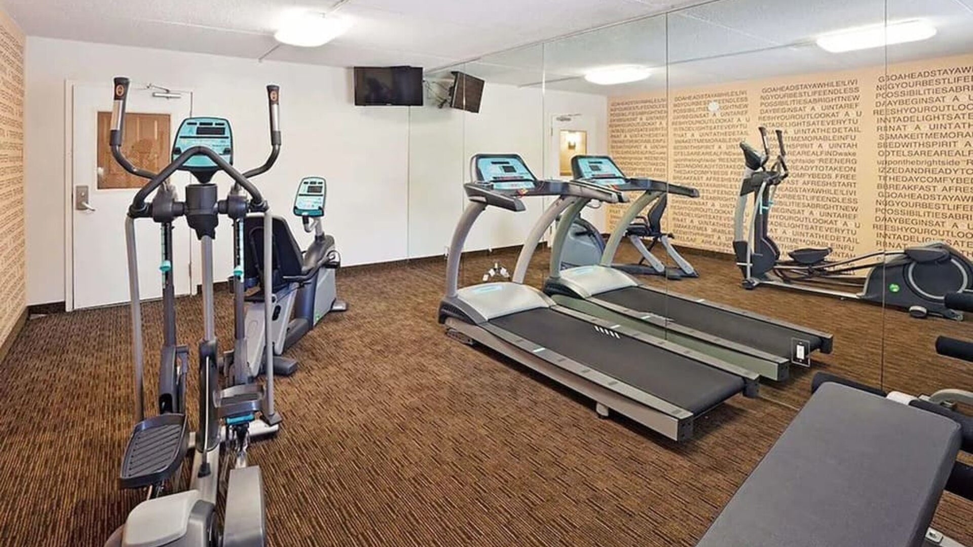 Fitness center at Norwood Inn Statefare Grounds.