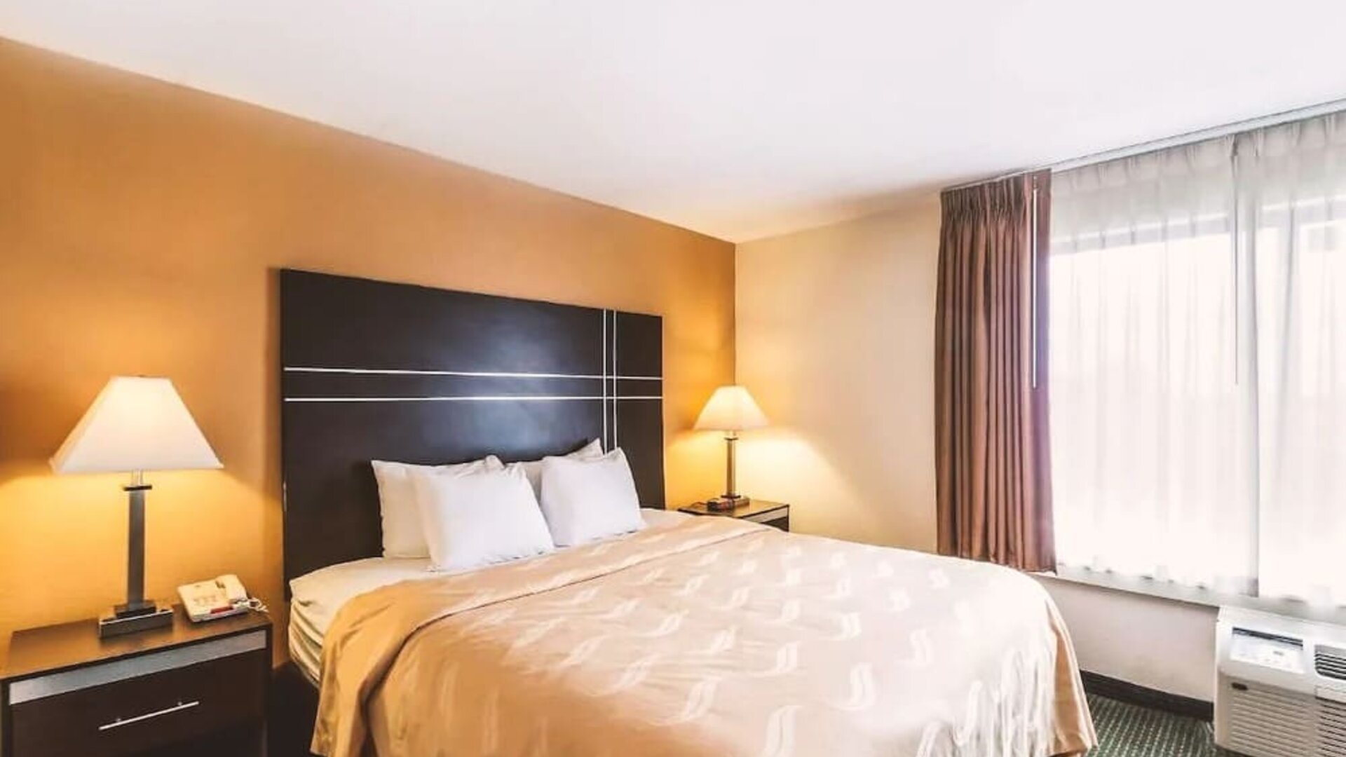 King bed at Hotel Inn Milwaukee.