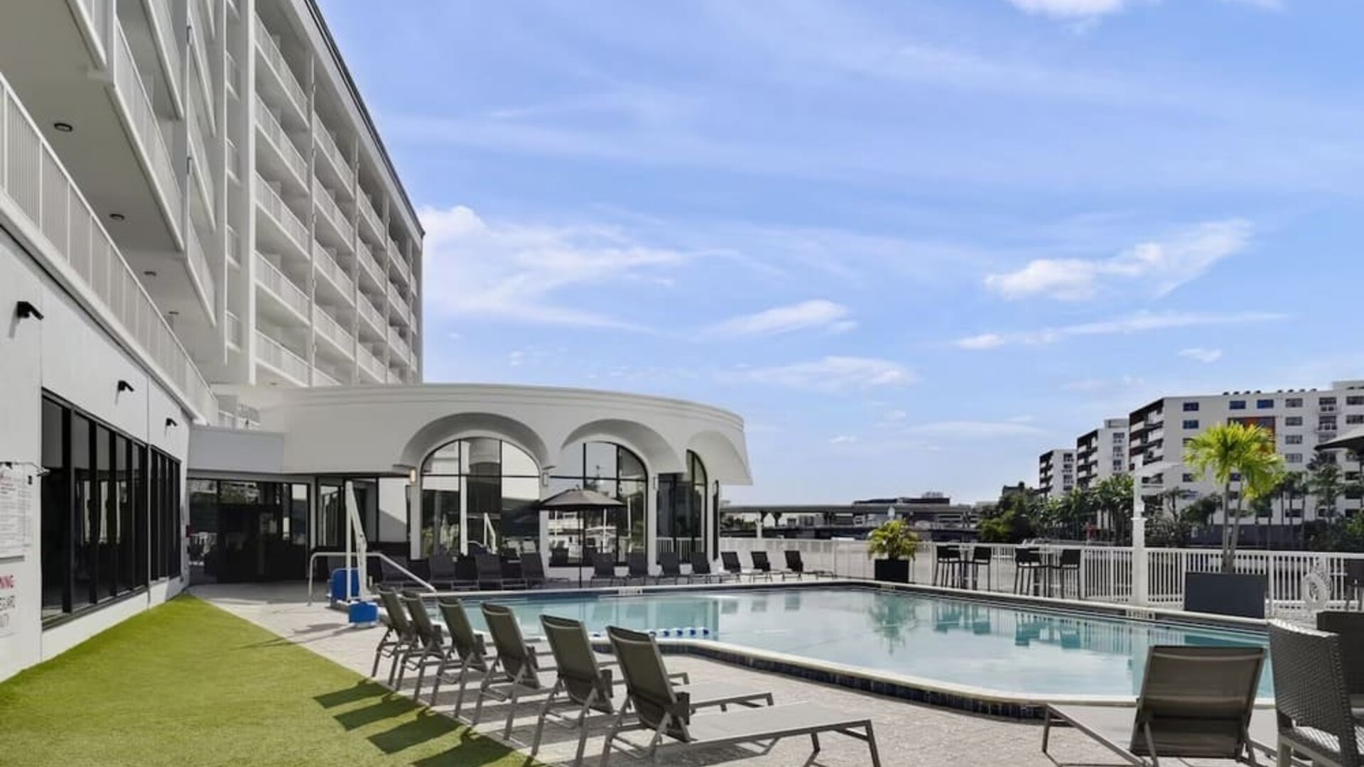 Outdoor pool with lounge chairs at Hotel Tampa Riverwalk.