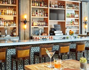 Cozy hotel bar at The Citizen Hotel, Autograph Collection.