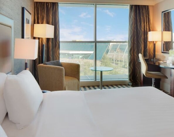 Day use room with work desk and lounge seating at DoubleTree By Hilton Newcastle International Airport.