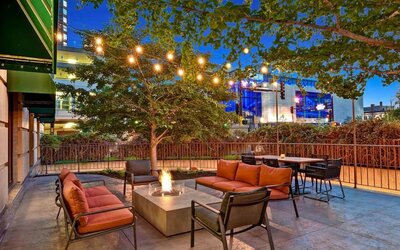 Hotel terrace with lounge seating and fire pit at Hilton Minneapolis.
