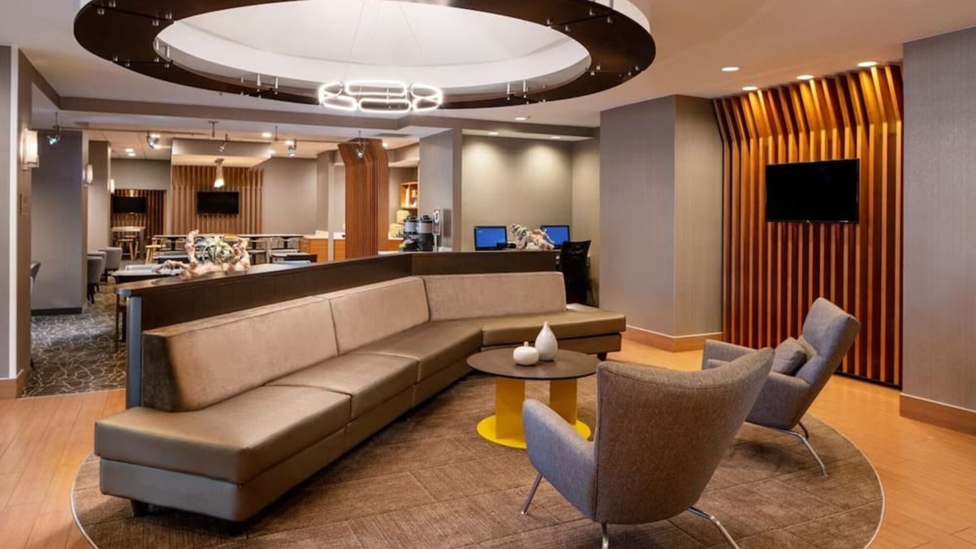 Co-working space is available in the lobby lounge, which features a sofa and pair of stylish chairs, plus a coffee table and TV.
