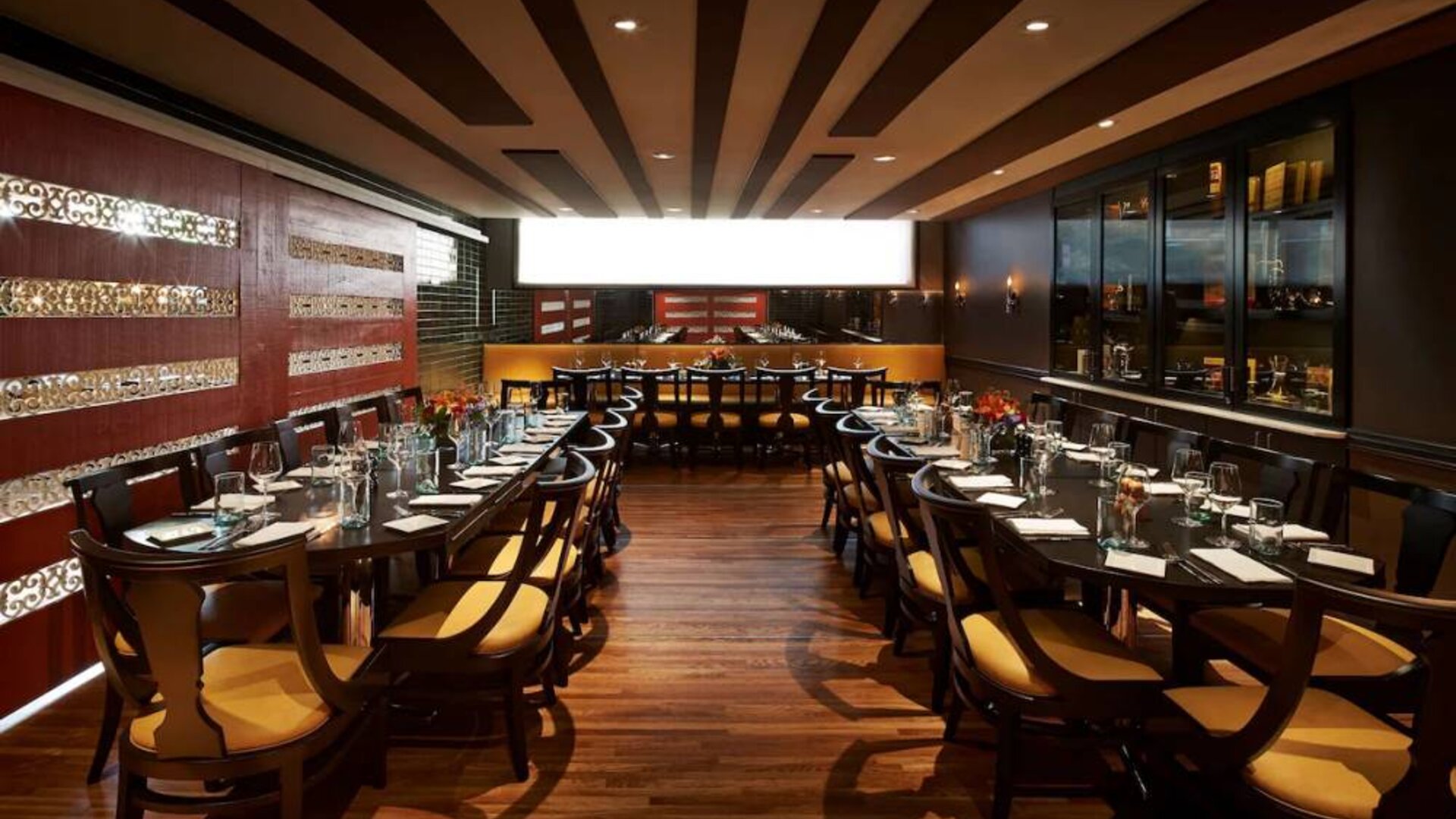 The hotel’s restaurant has a hard floor, long tables, and serves Italian coastal cuisine.