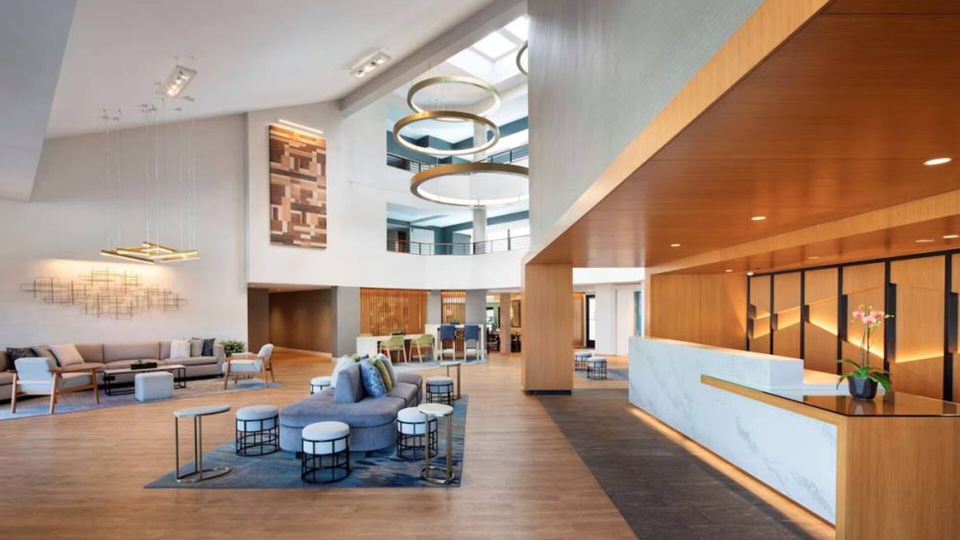 The hotel’s lobby lounge has comfy seating, coffee tables, and plenty of space for guests to socialize and co-work.