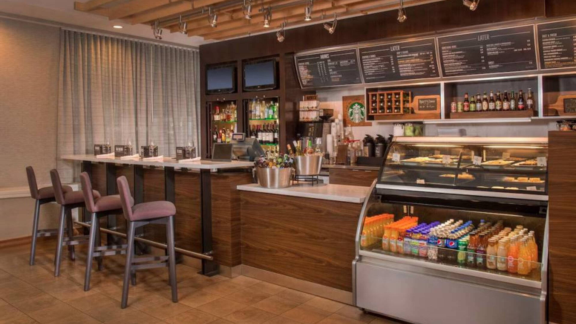 Sonesta Select Arlington Rosslyn breakfast area provides a range of healthy dining options, plus tall stool seating and multiple televisions.