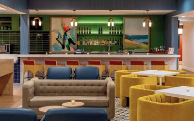 Sonesta Select Boston Foxborough Mansfield’s on-site restaurant The Commons has tall bar stool and table seating, plus a wide range of beverages at the bar.