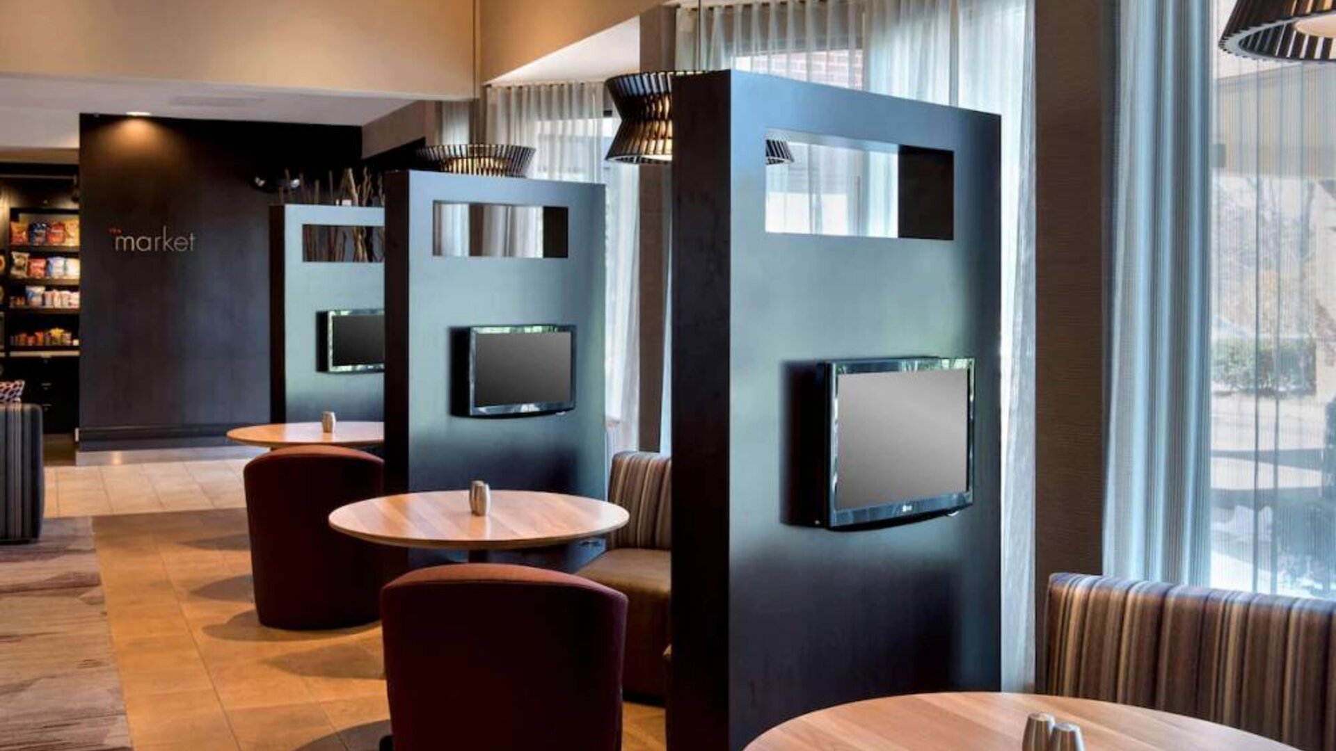 Sonesta Select Boston Milford’s media pods are cozy nooks with comfy seating, televisions, and coffee tables.