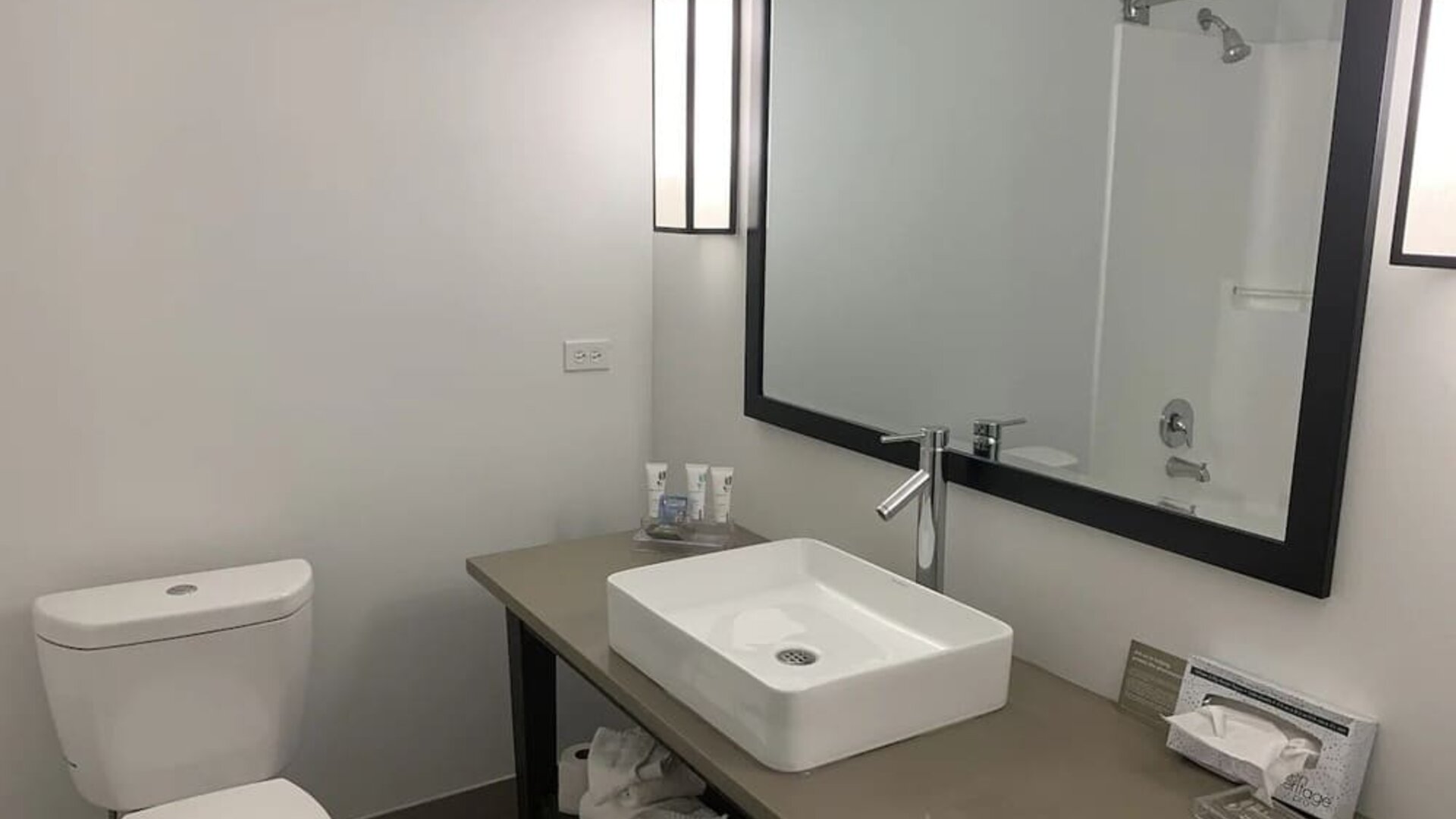 Guest bathroom with shower at Country Inn & Suites By Radisson, Chicago O'Hare South.